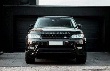 Black Range Rover in a garage