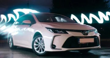 White Toyota with light trails