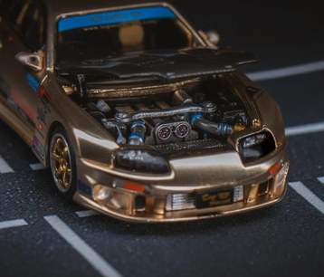 Gold sports car with open bonnet